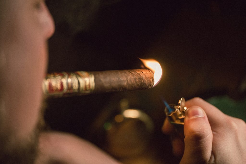 Lighting a cigar