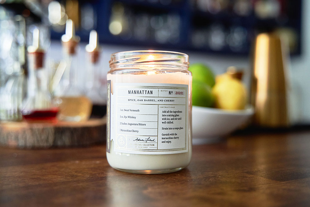 A sweet smelling candle helps set the atmosphere at a cocktail party